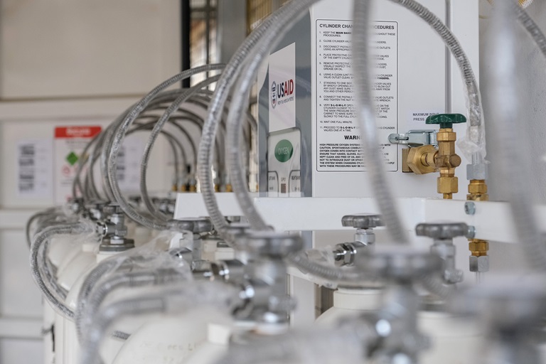 man checking the oxygen tanks